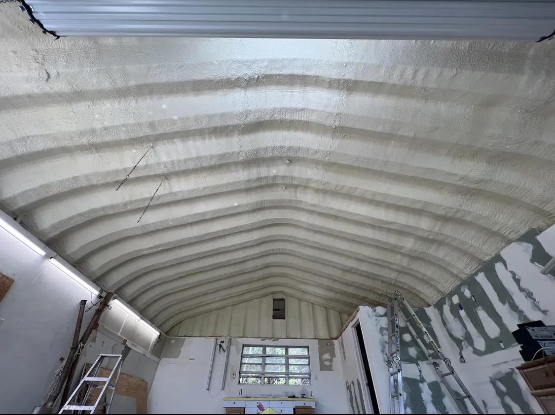Spray polyurethane foam applied to the underside of a metal roof deck in Caribou